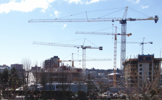 Keeping Our Eyes on our work while cranes Swing overhead